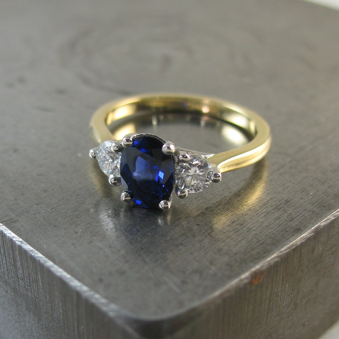 A bespoke sapphire engagement ring with a lattice design setting
