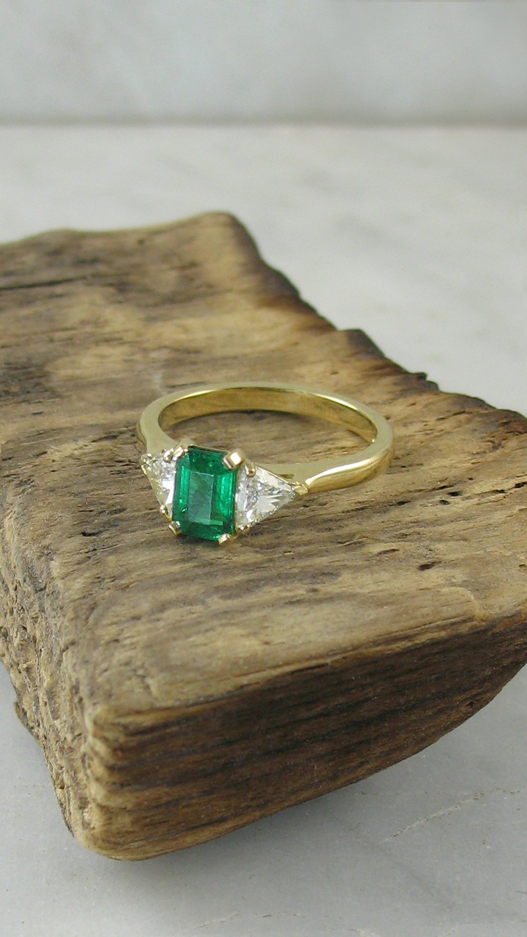 An octagonal step cut emerald&nbsp;engagement ring
