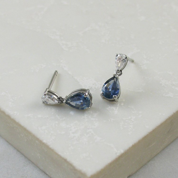 An alluring pair of pear shaped Montana teal sapphire drop earrings