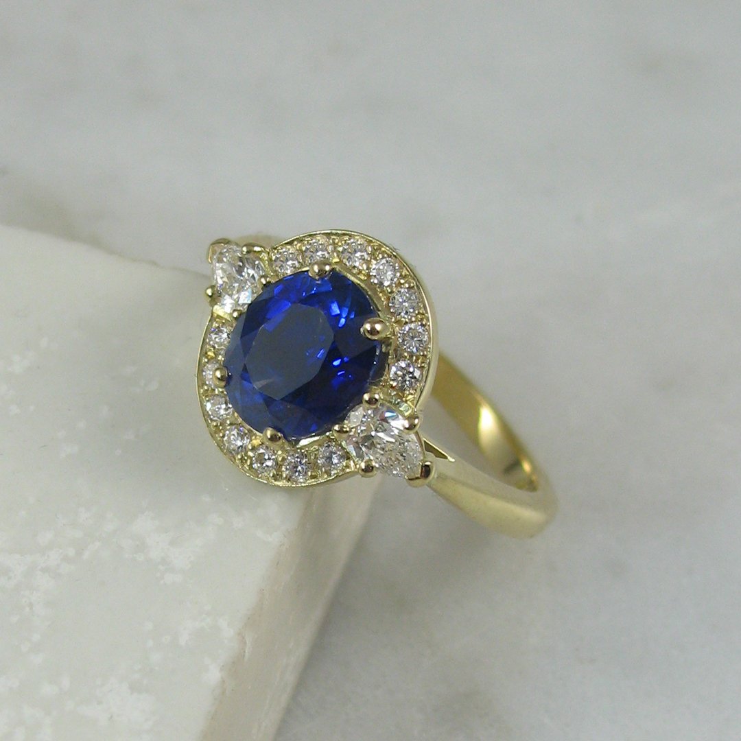 An attractive bespoke sapphire and diamond engagement ring