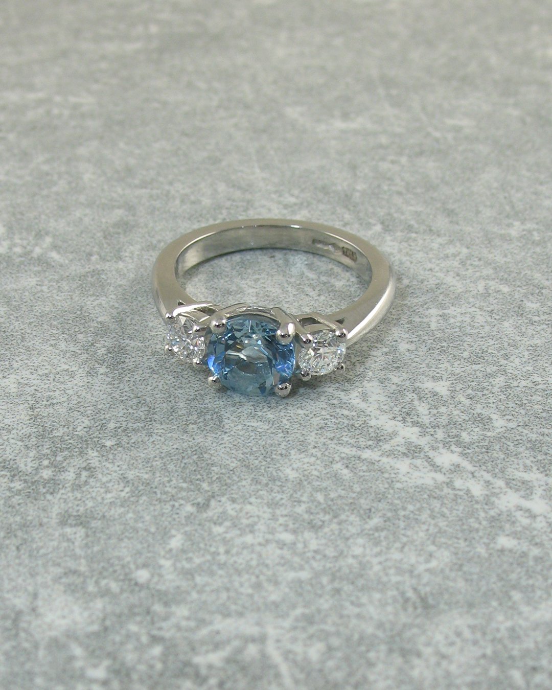 A bright and beautiful three stone aquamarine ring