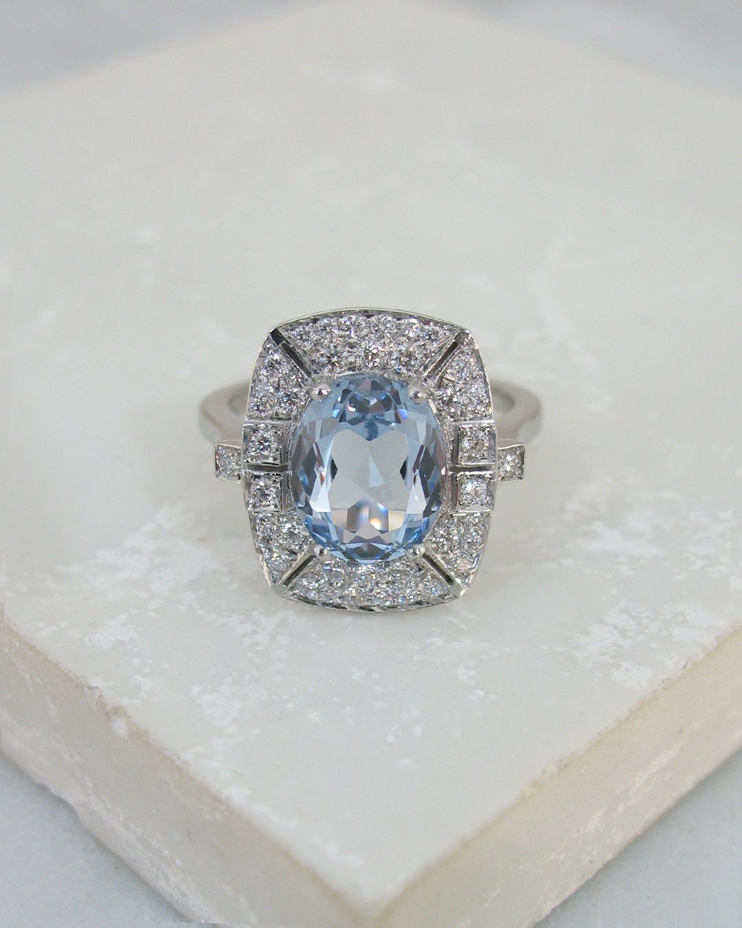 An Art Deco style diamond and aquamarine ring