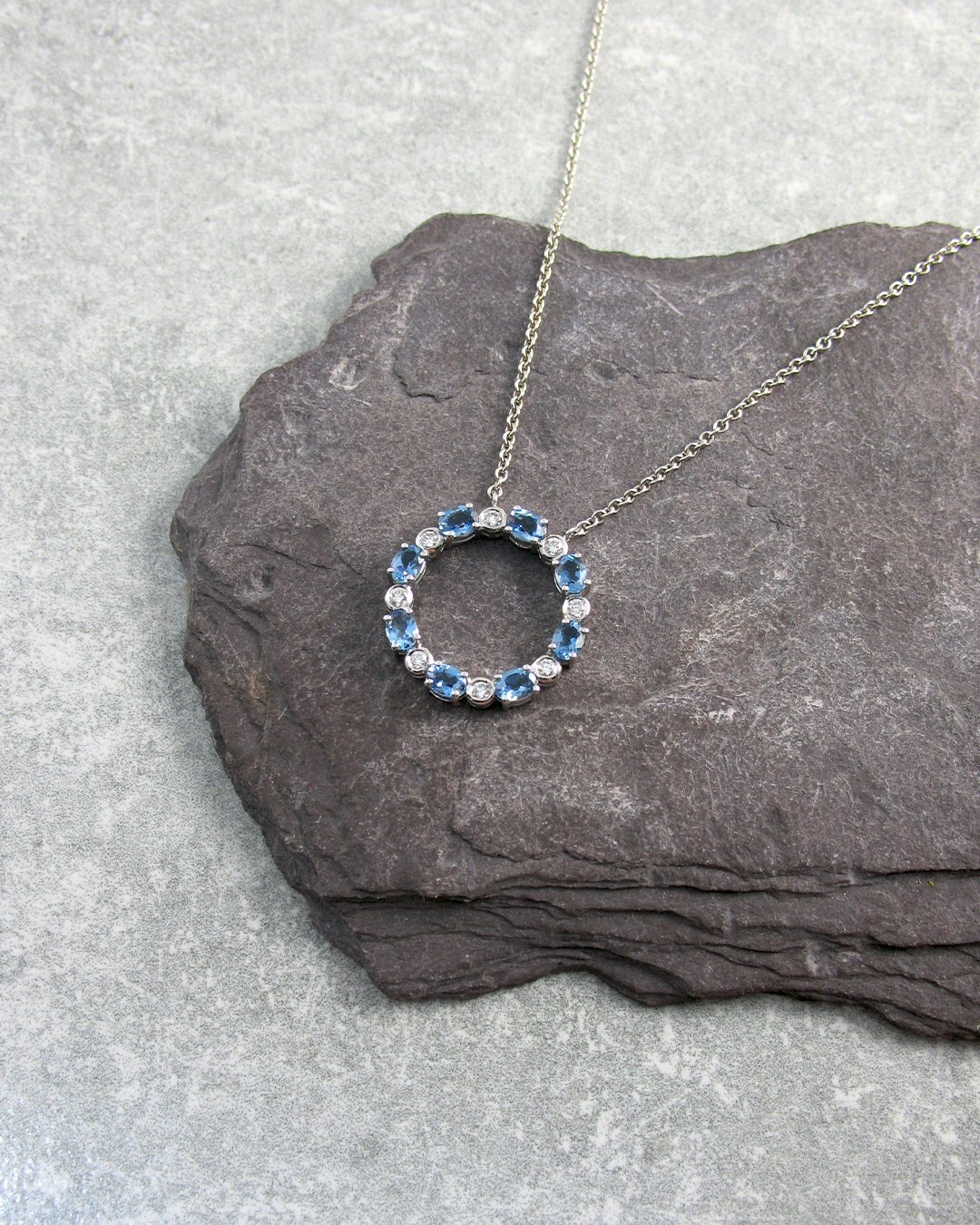 A circle shaped aquamarine pendant.jpg