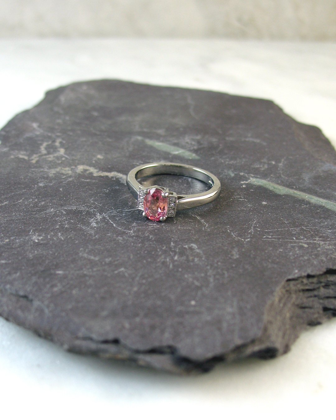 An exquisite Padparadscha sapphire engagement ring