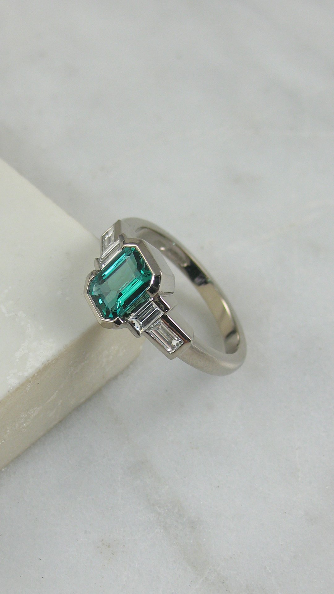 A gorgeous bespoke emerald engagement ring