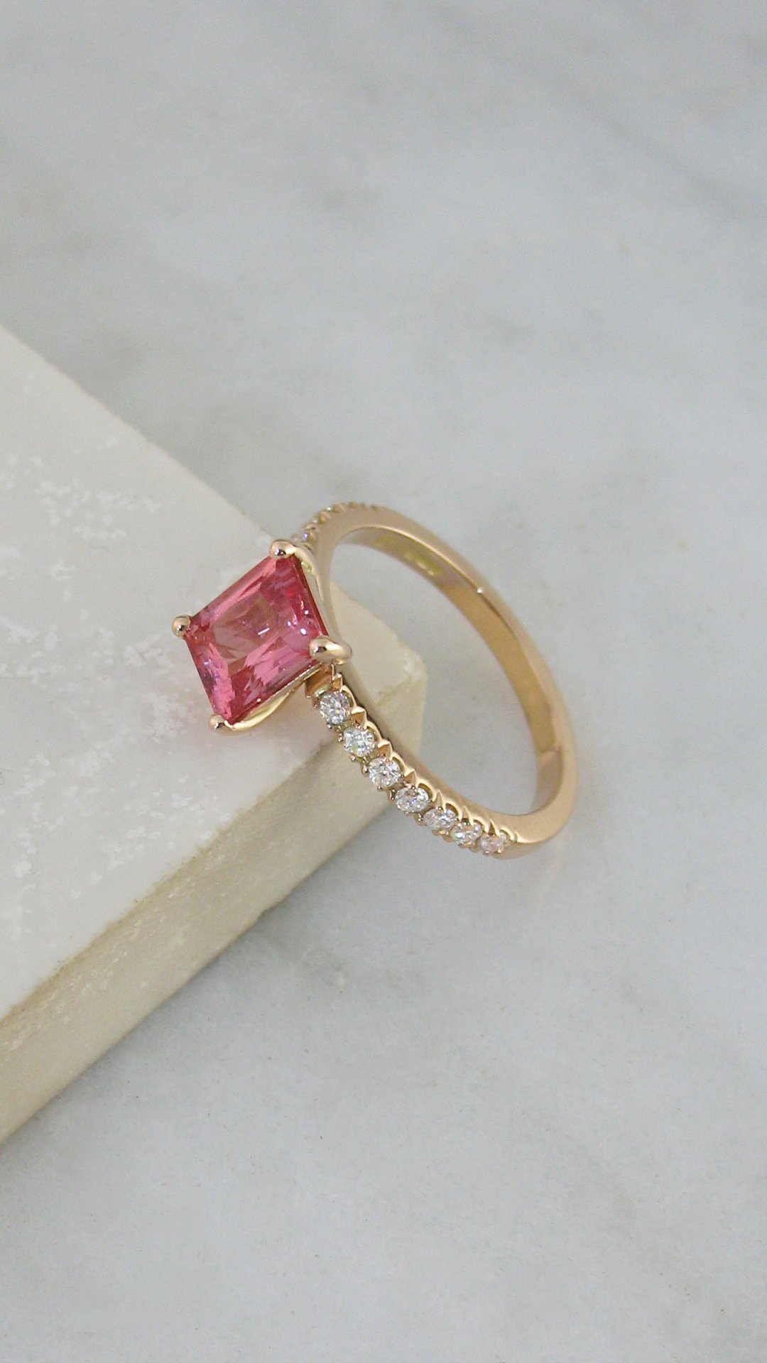 A beautiful rose gold custom Padparadscha sapphire engagement ring 