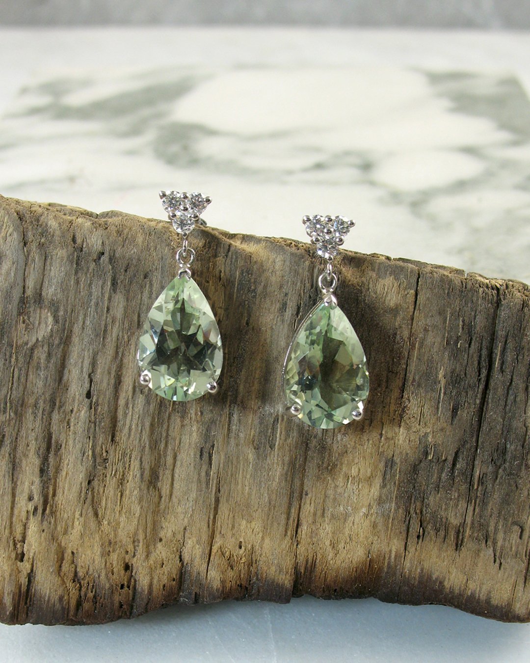 An elegant pair of diamond and green quartz drop earrings