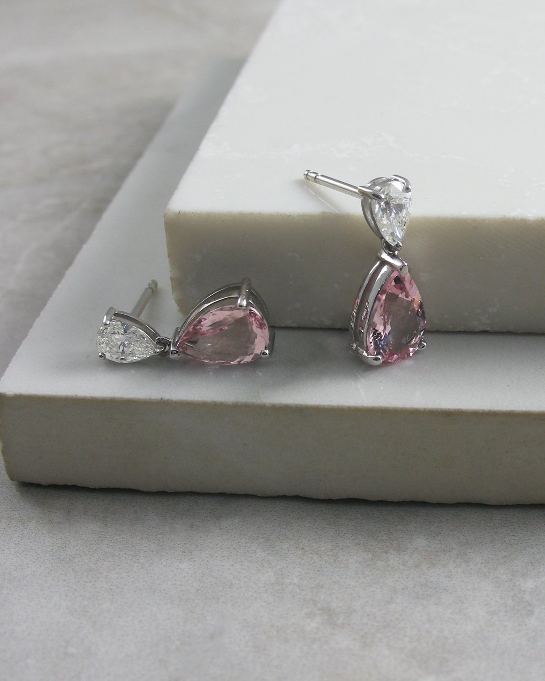 A vibrant transparent peach pink pair of morganite drop earrings