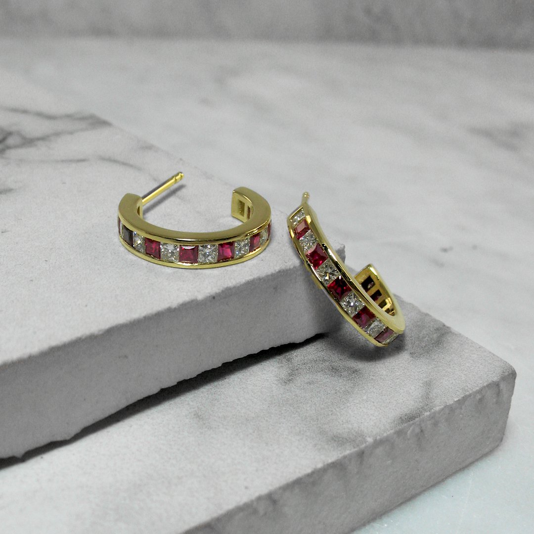 A pair of custom diamond and ruby earrings 