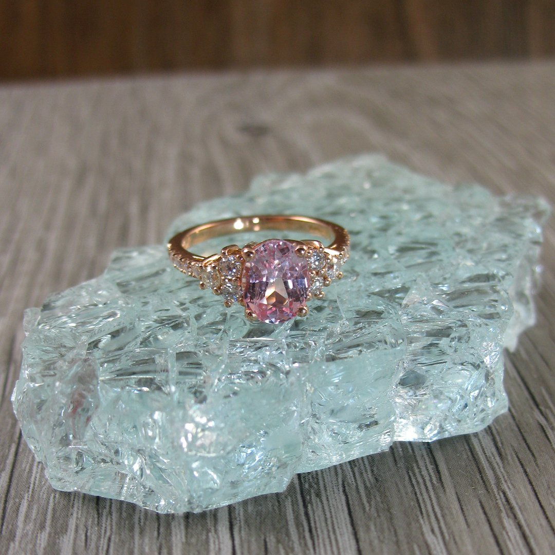 A gorgeous Padparadscha bespoke  sapphire engagement ring