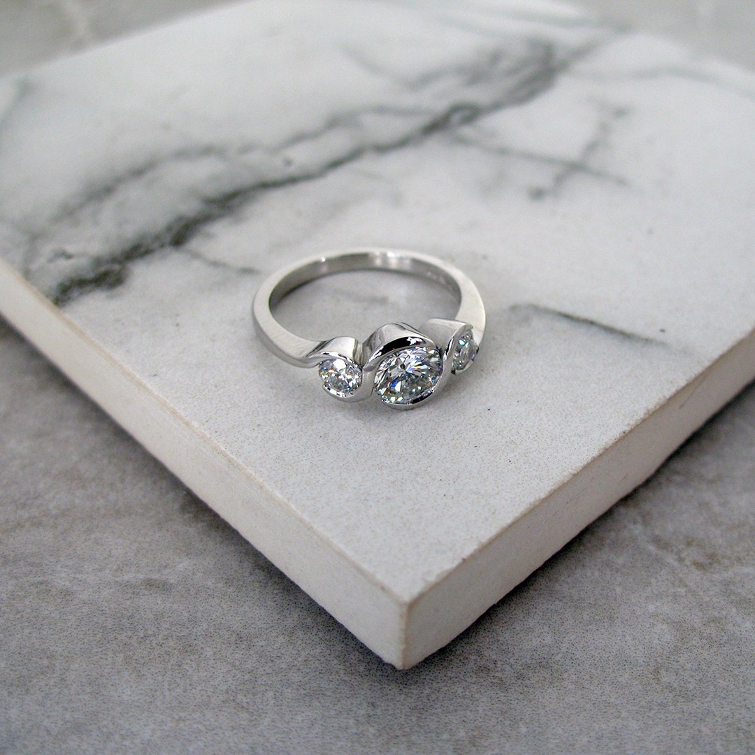 An alluring bespoke diamond trilogy ring