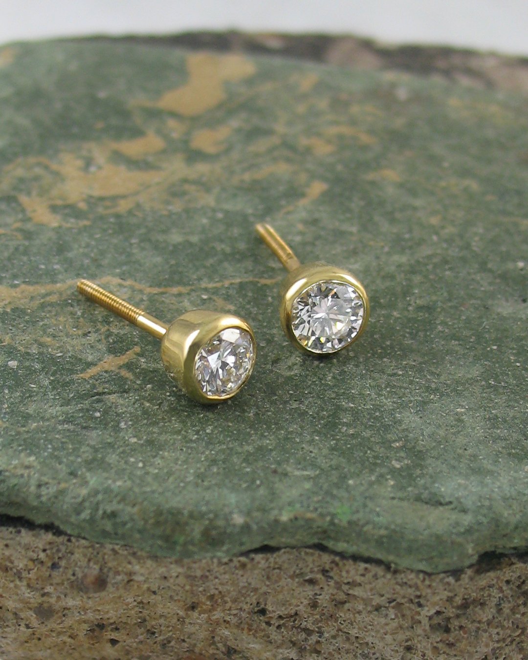 A pair of classic diamond stud earrings