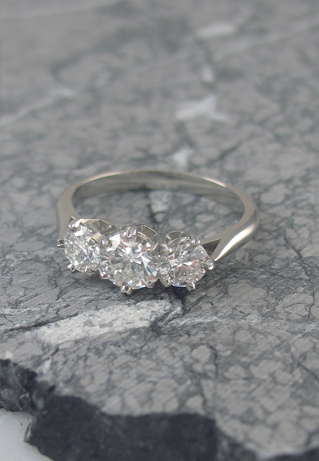 A classic vintage diamond trilogy engagement ring