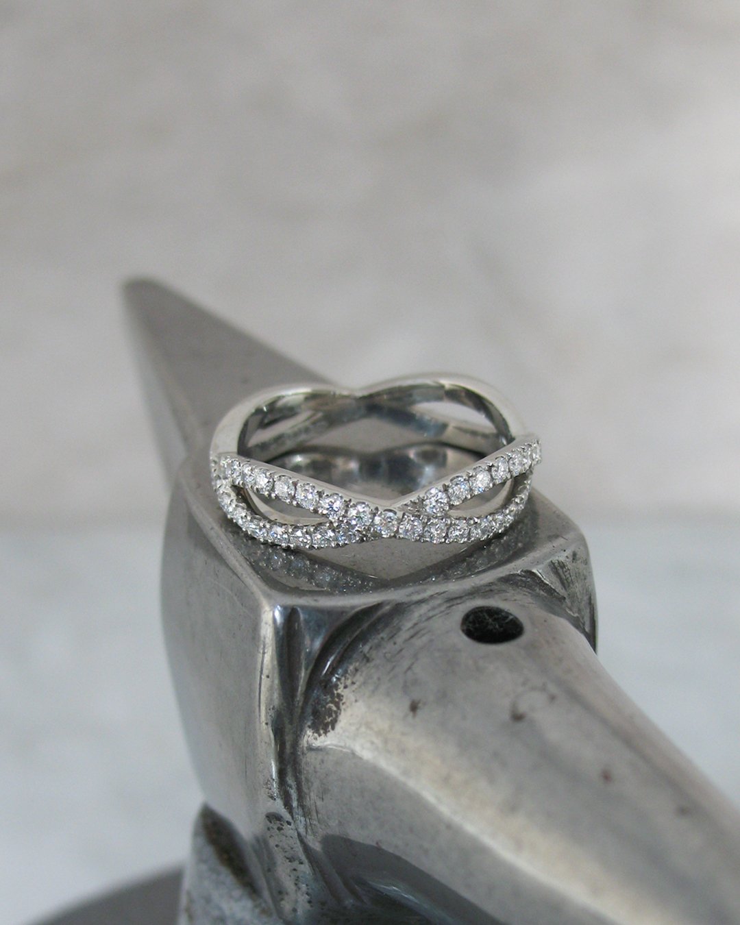 An elegant woven diamond wedding ring