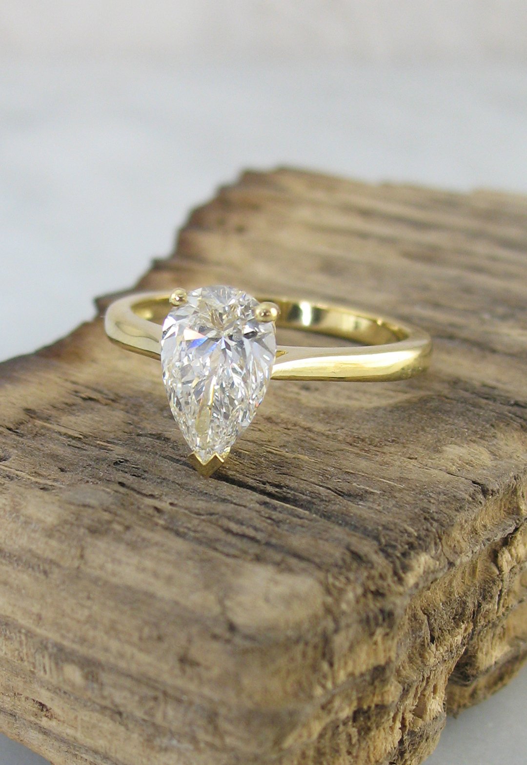 A classic pear-shaped diamond solitaire engagement ring