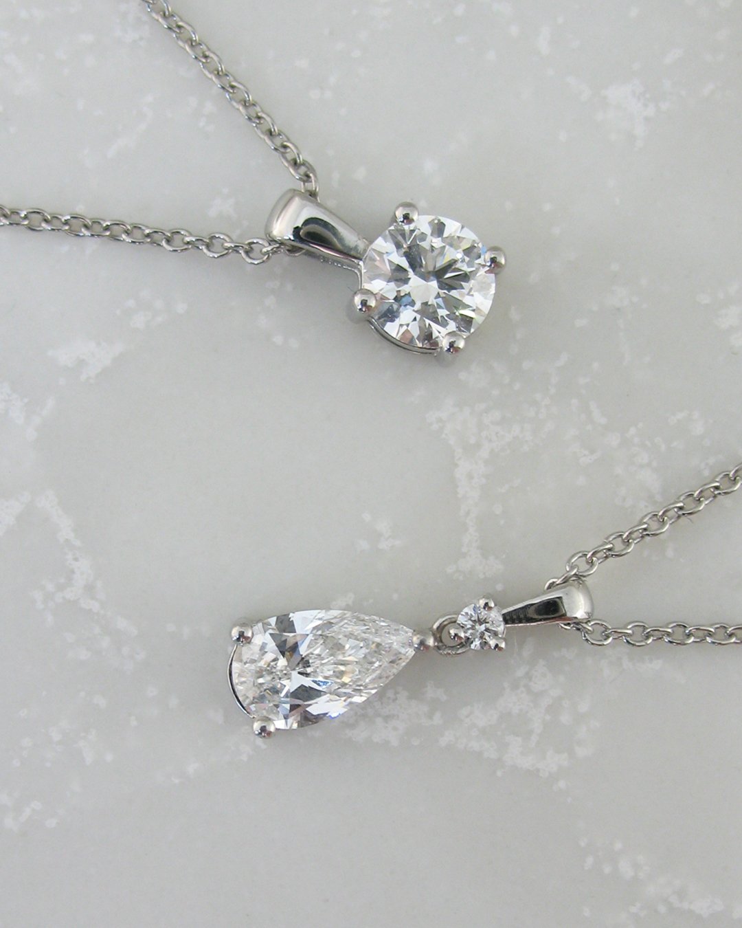 A stunning pair of custom diamond  pendants.jpg