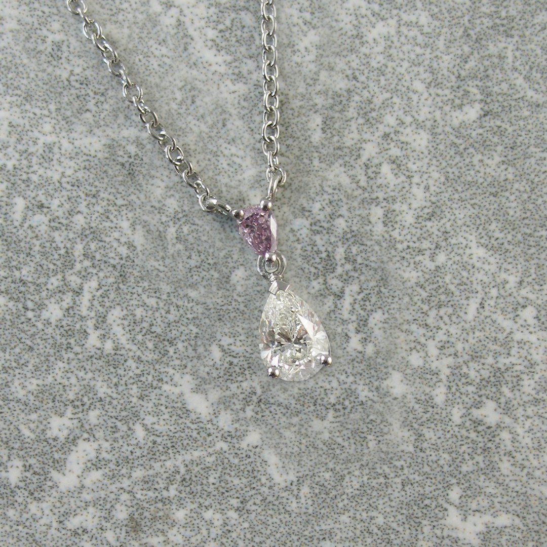 A white and pink diamond necklace
