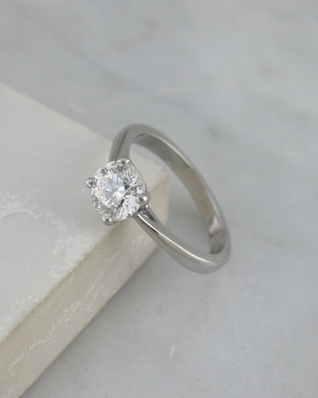 A traditional solitaire diamond engagement ring