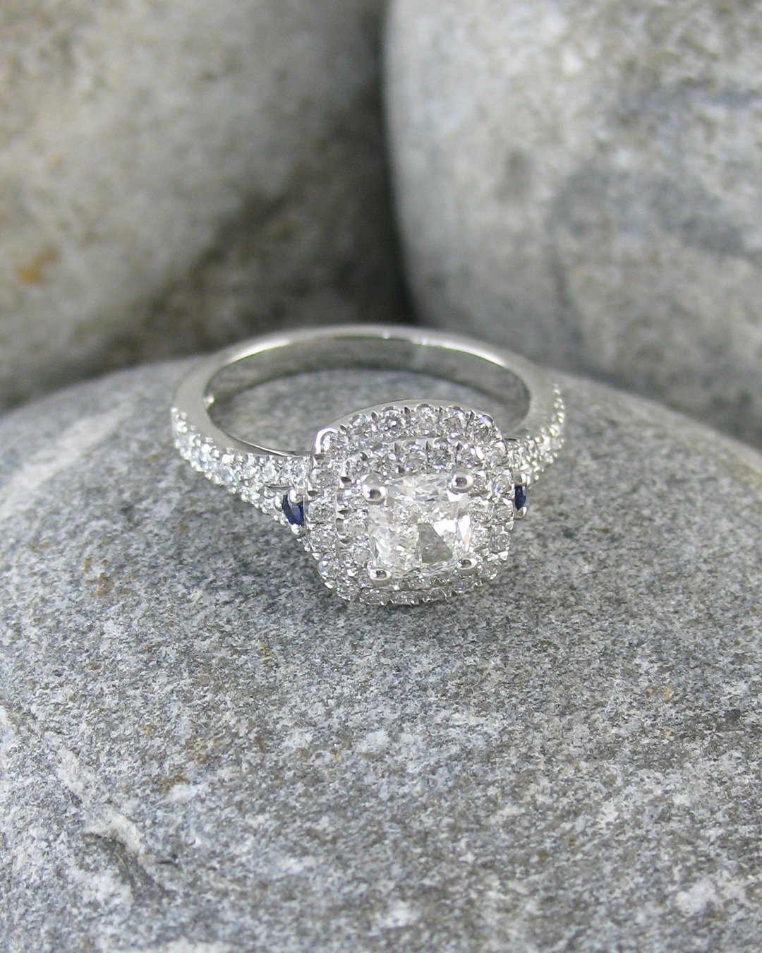 A bespoke diamond halo engagement ring