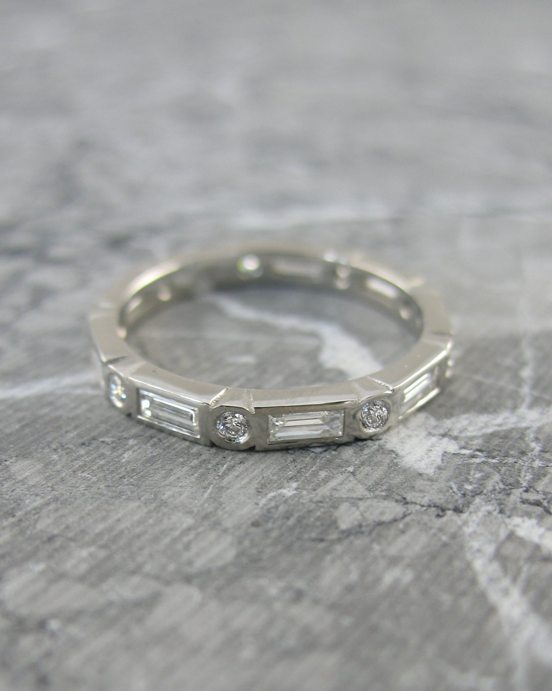 A custom baguette cut diamond eternity ring
