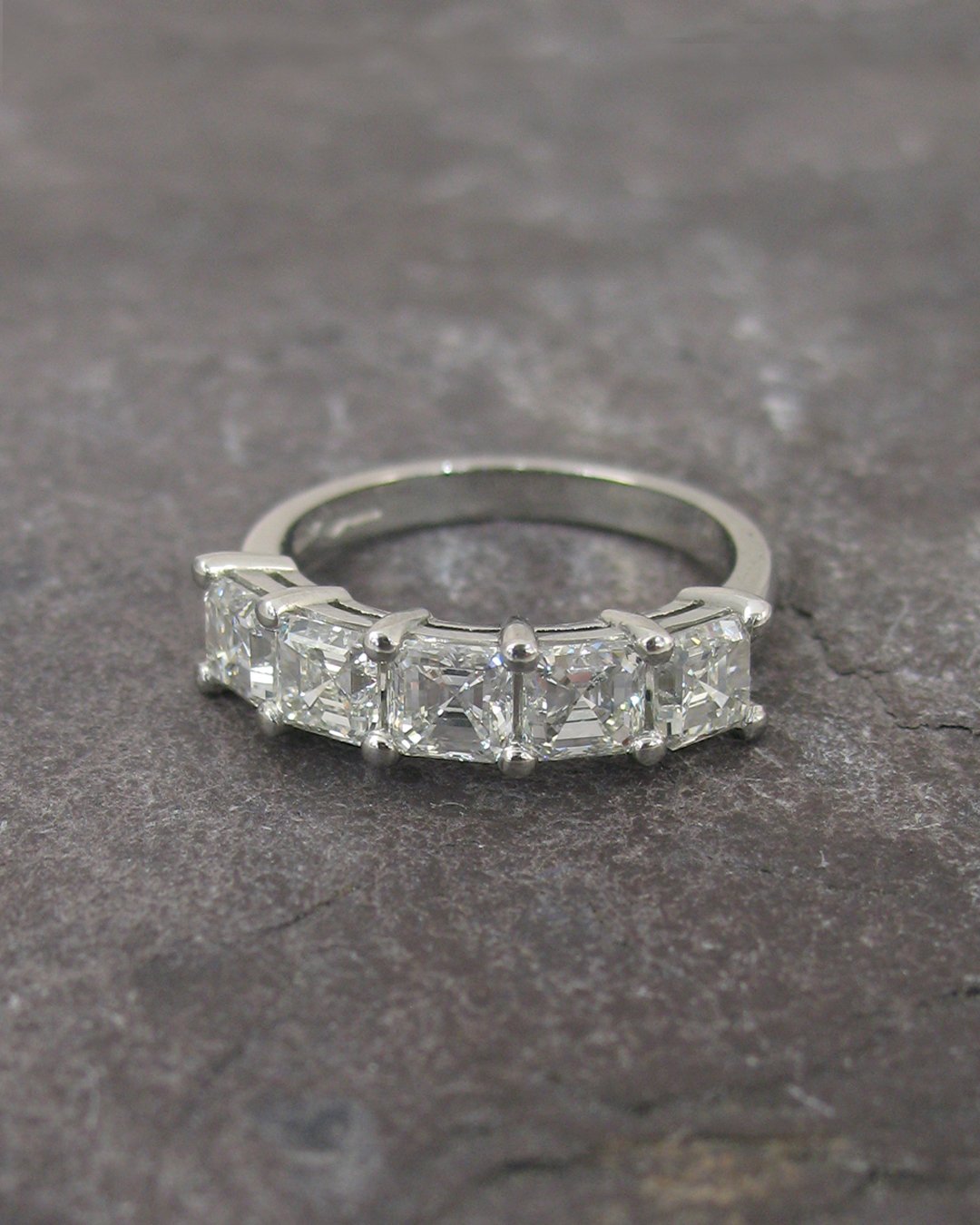 A five stone asscher cut diamond engagement ring