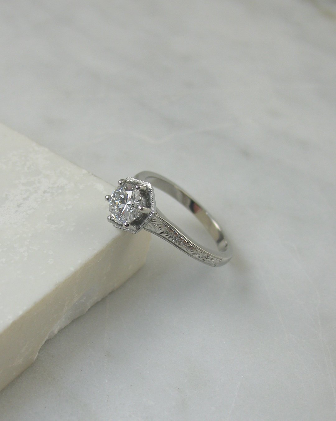 An orange blossom engraved diamond bespoke engagement ring