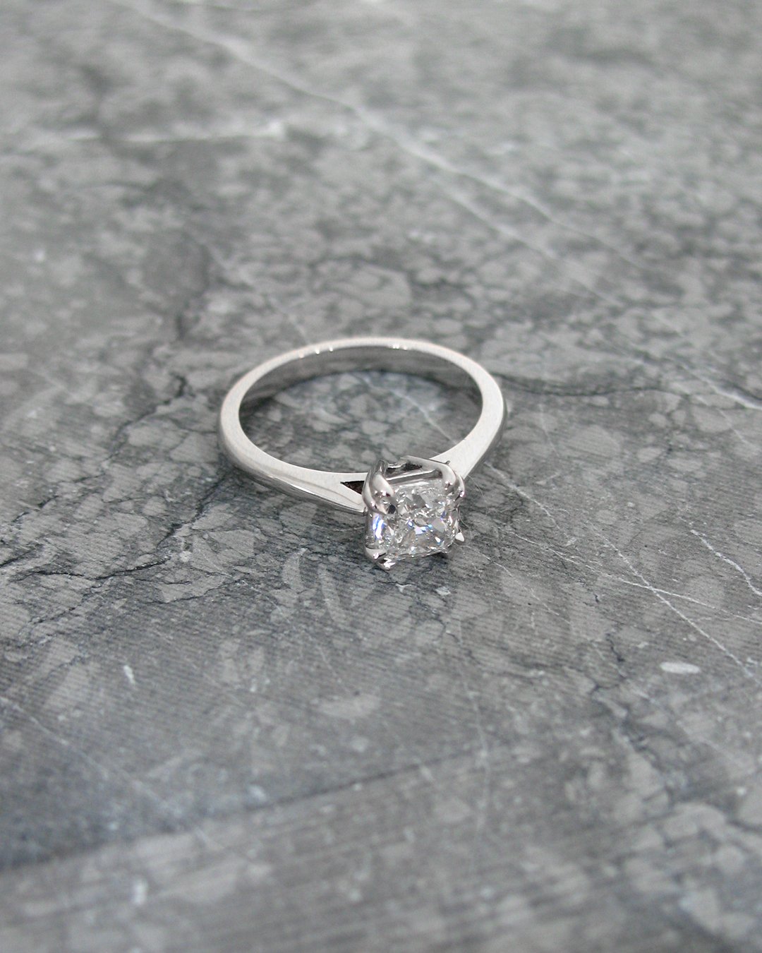 A classy cushion cut diamond engagement ring