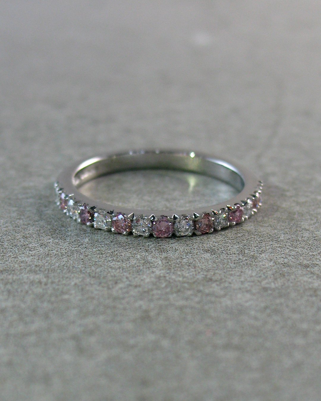 Pink and white diamonds in a custom eternity ring