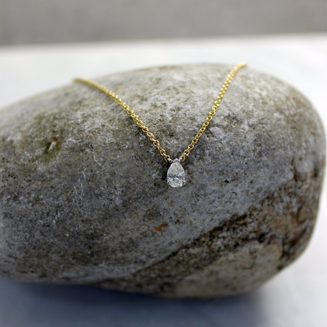A stunning pear shaped diamond drop necklace