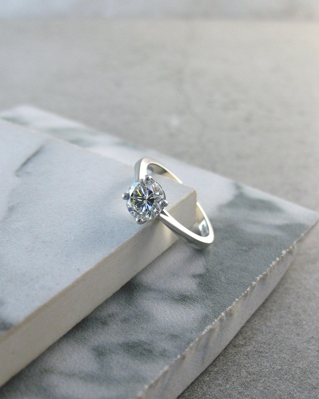 A classic platinum solitaire diamond engagement ring