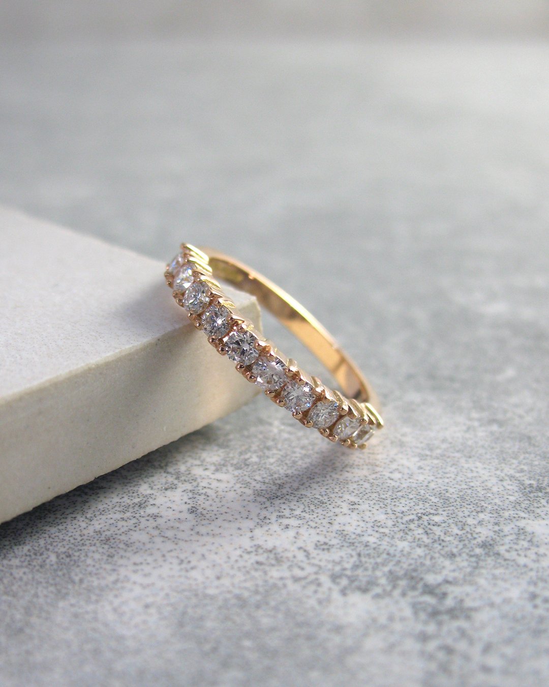 A simple rose gold and diamond eternity ring