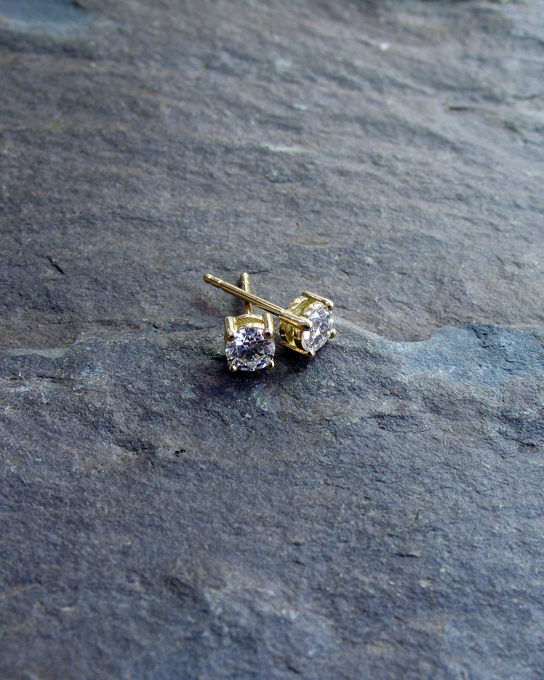 A classic pair of yellow gold diamond stud earrings