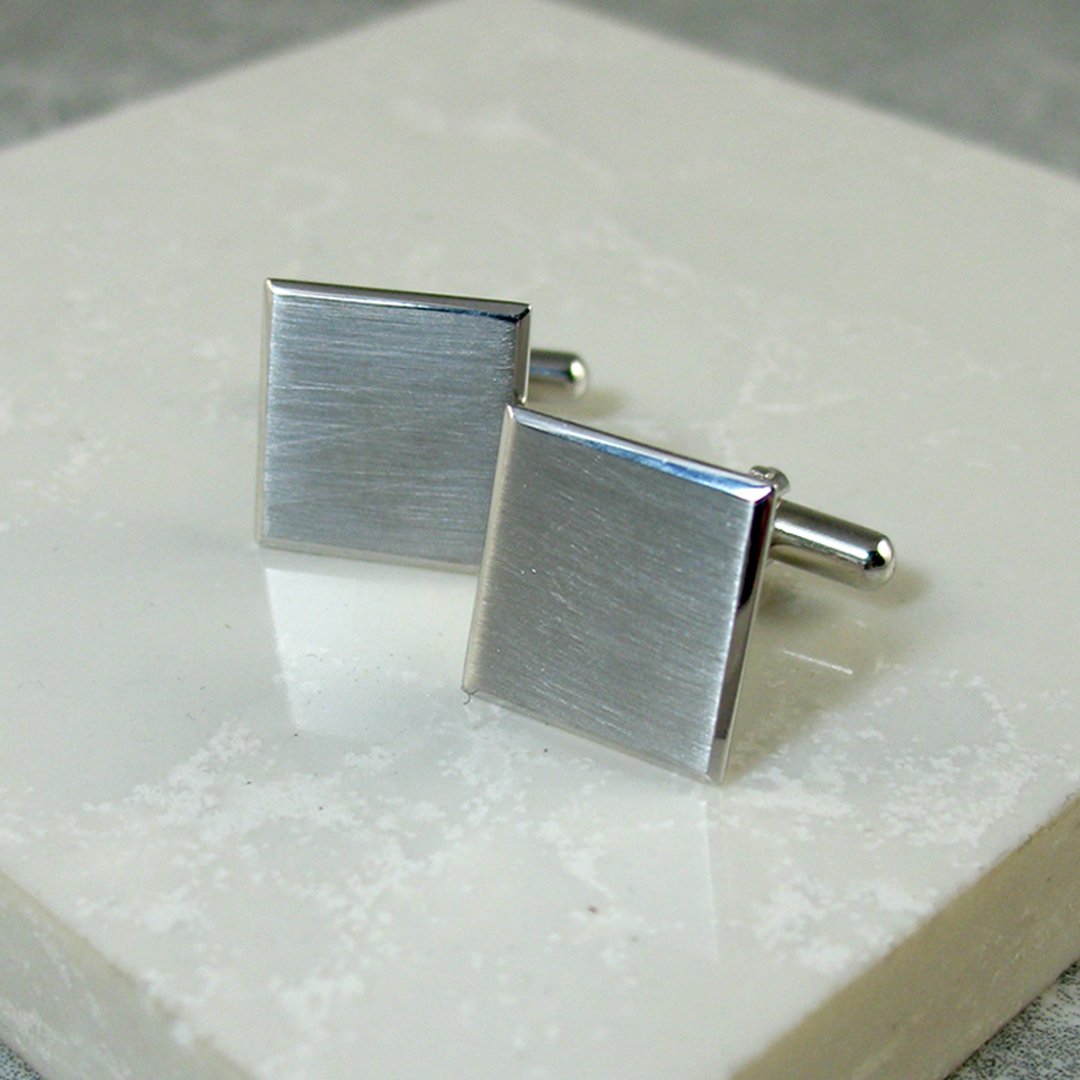 A pair of brushed sterling silver bespoke  cufflinks