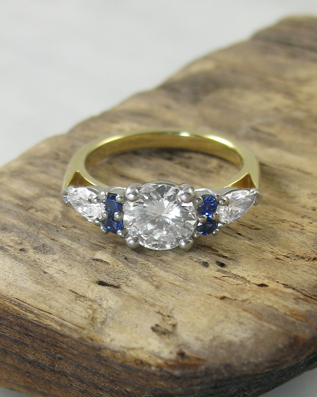 A traditional diamond and sapphire engagement ring