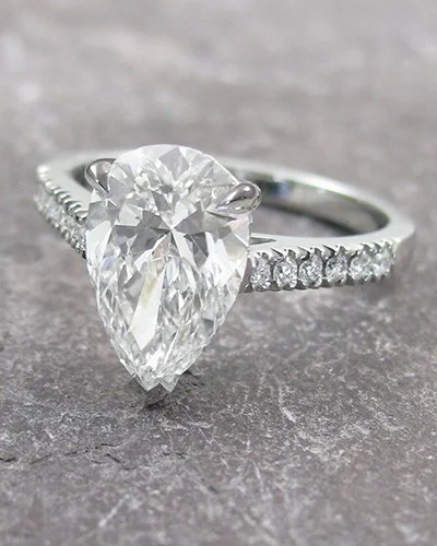 Pear shaped diamond engagement ring diamond shoulders platinum 400.jpg
