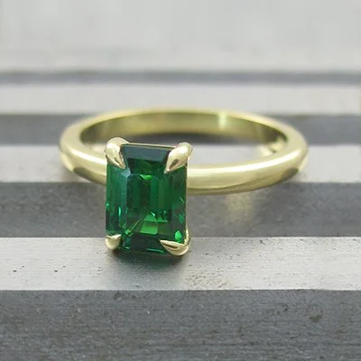 Octagonal step cut tsavorite garnet solitaire engagement ring 18ct yellow gold.jpg