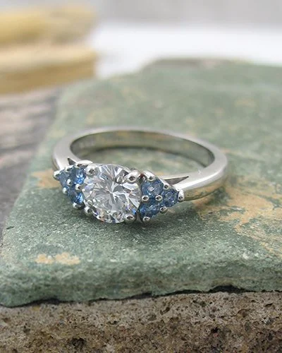 A beautiful diamond and aquamarine trefoil engagement ring platinum.jpg