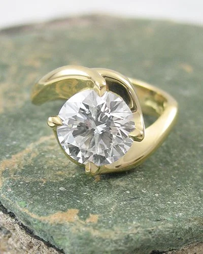 18ct yellow gold curves in a distinctive twist round diamond engagement ring.jpg