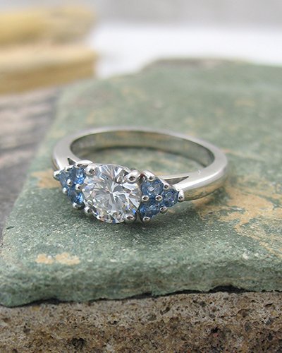 A beautiful diamond and aquamarine trefoil engagement ring platinum.jpg