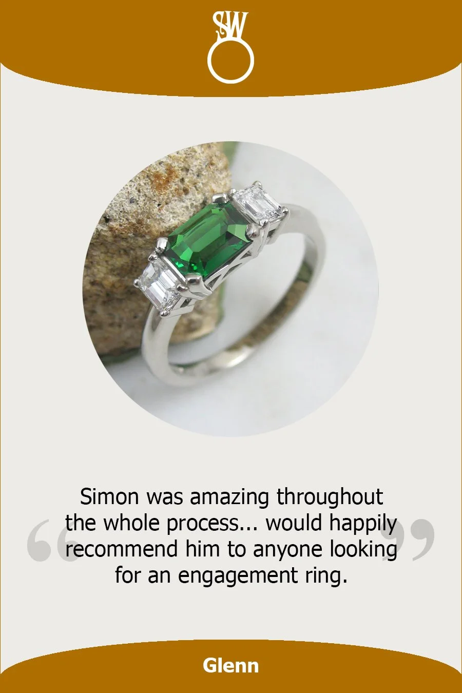 An octagonal step cut tzarovite garnet and emerald cut diamong engagement ring set in four claw settings of platinum.jpg