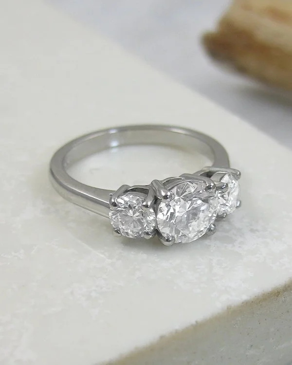 A three stone diamond trilogy ring seting platinum.jpg