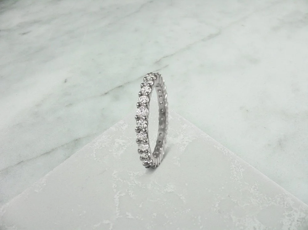 Shared claw full diamond eternity ring