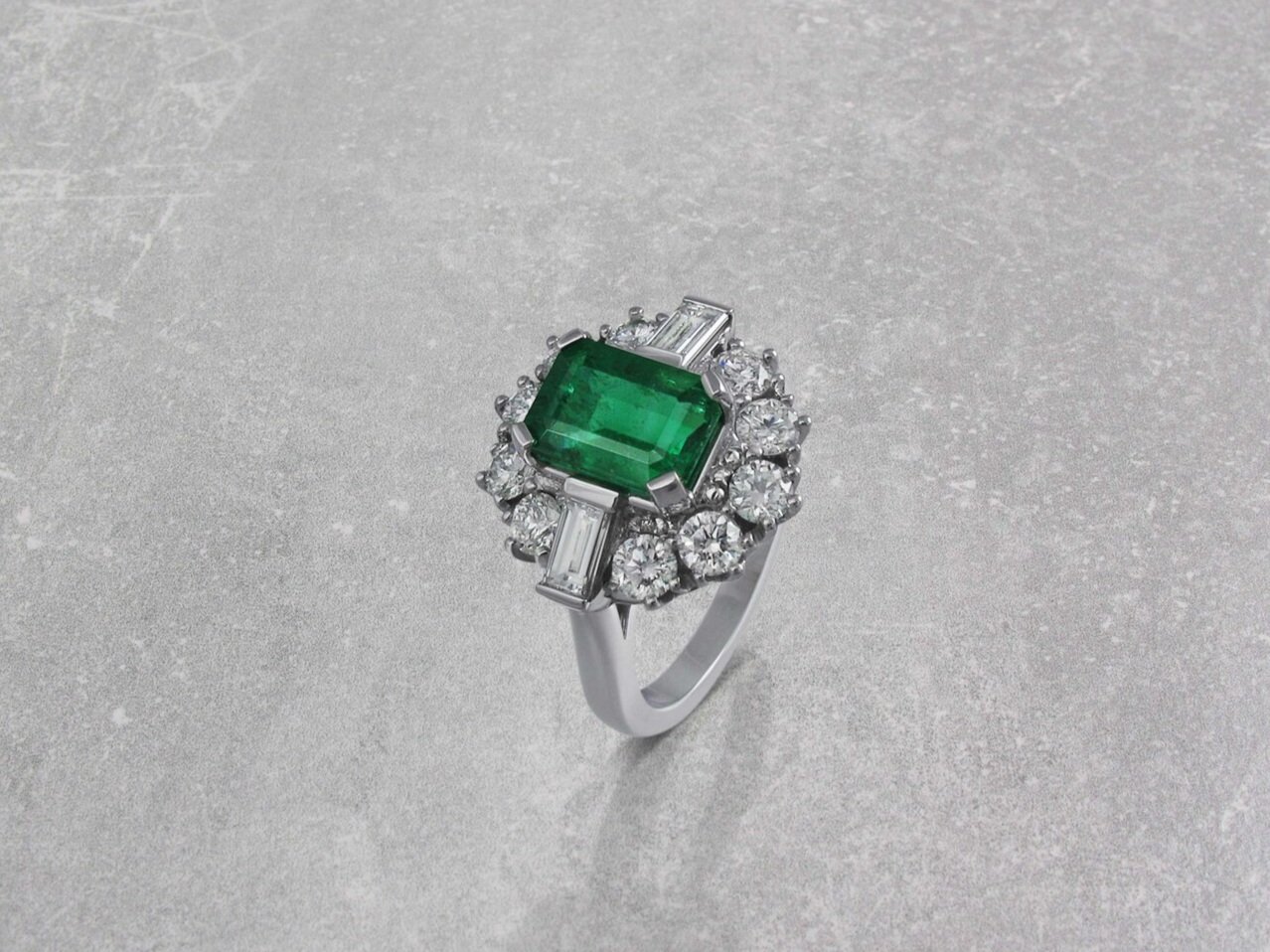 Emerald and diamond vintage style cluster ring