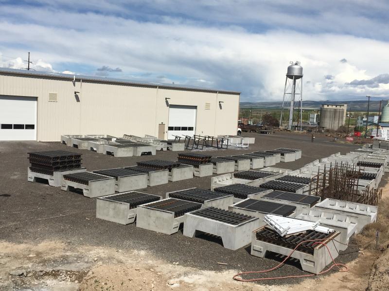 Precast concrete bases and steel cattle guards