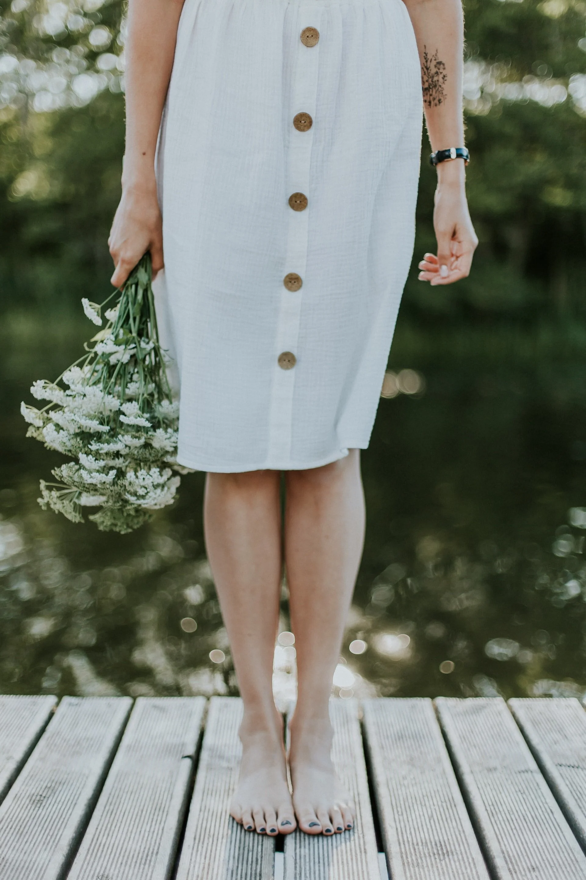 woman holding flowers unsplash.jpg