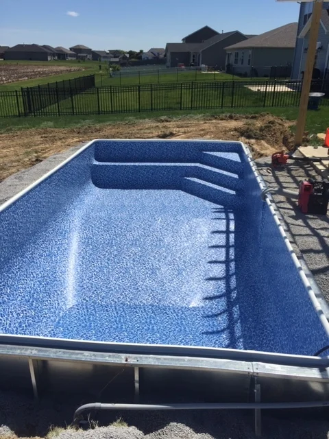 Inside Corner Stair with Bench. View of steel walls. 