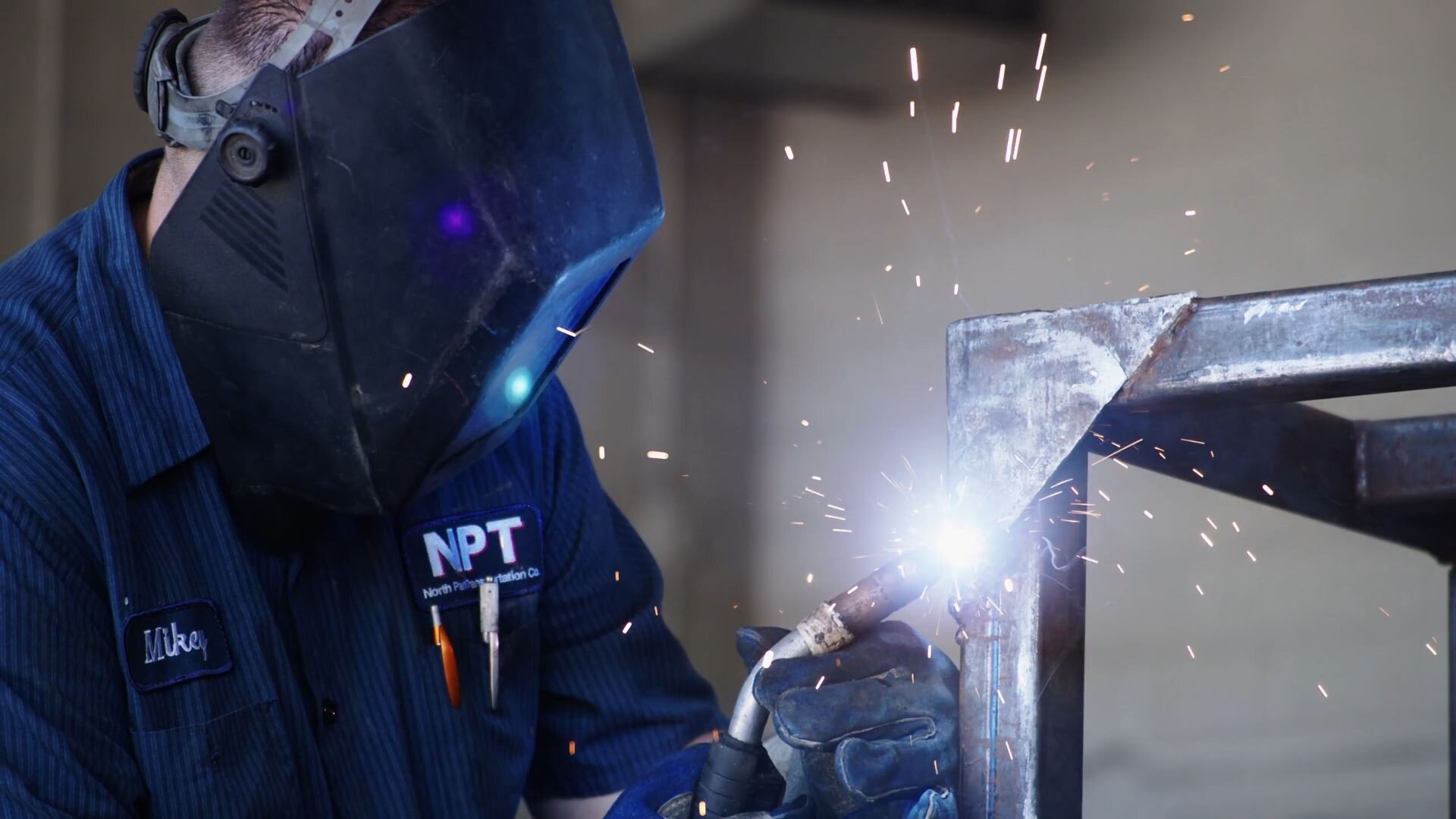 NPT employee welding steel