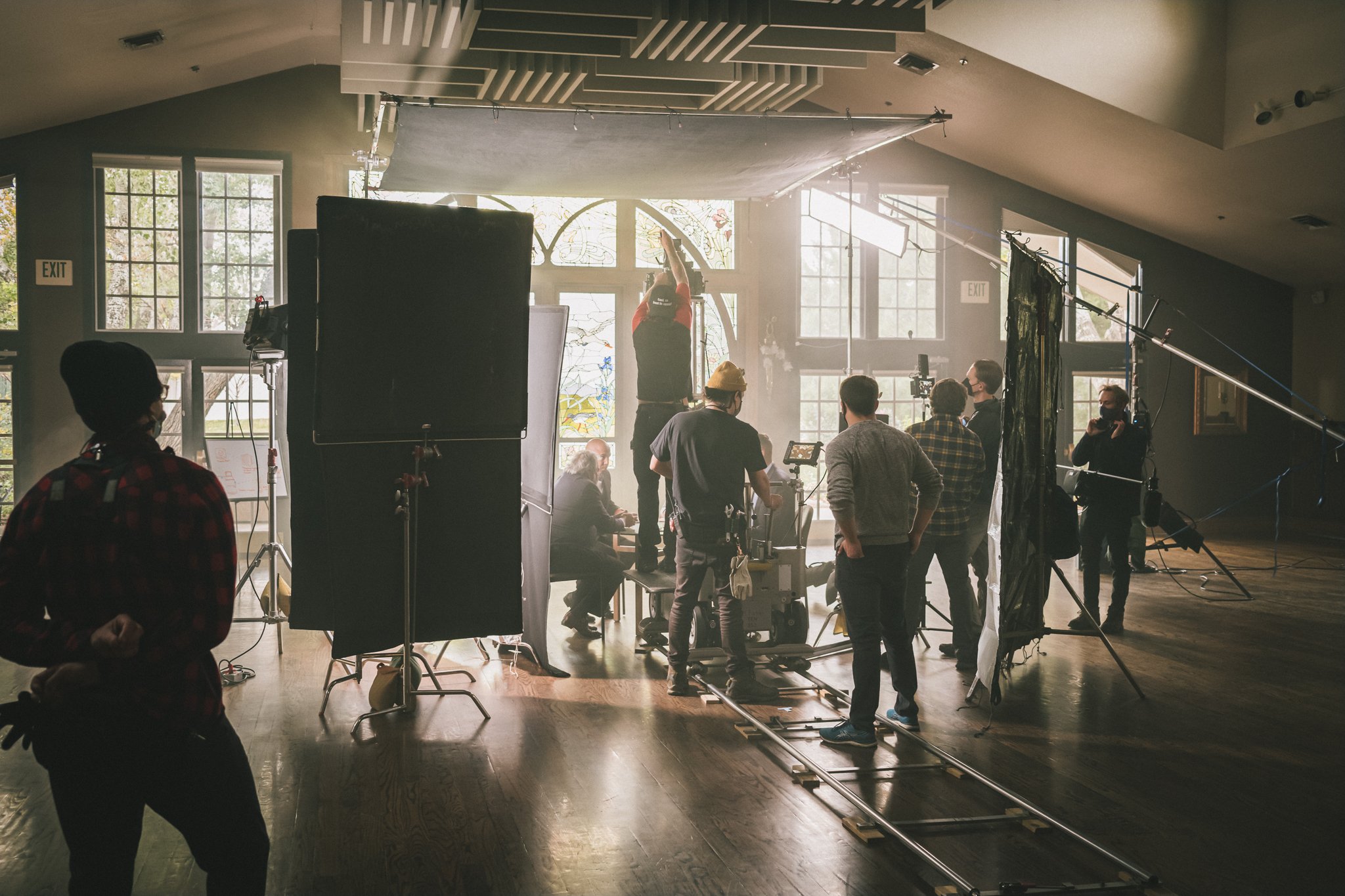 video shooting of a man wearing VR headset inside a room