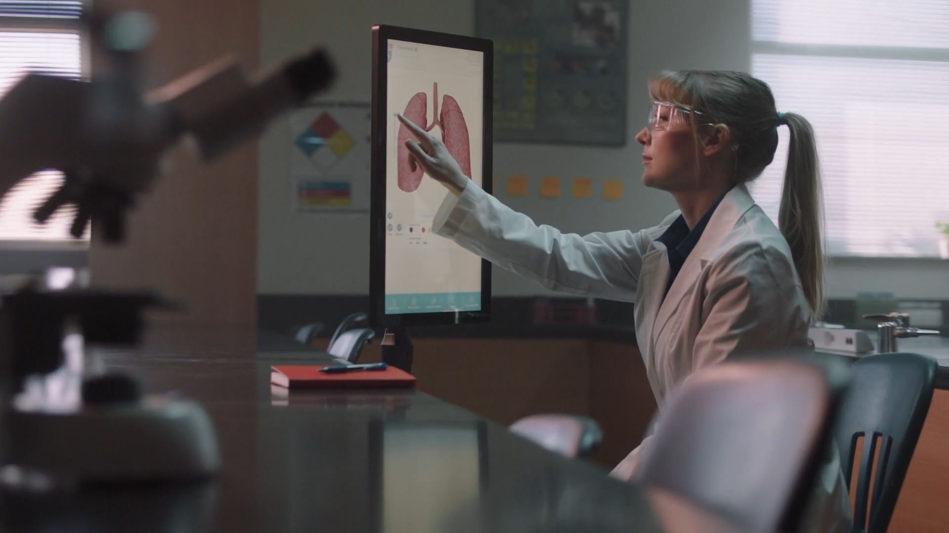  doctor studying a lung chart on the screen inside the laboratory
