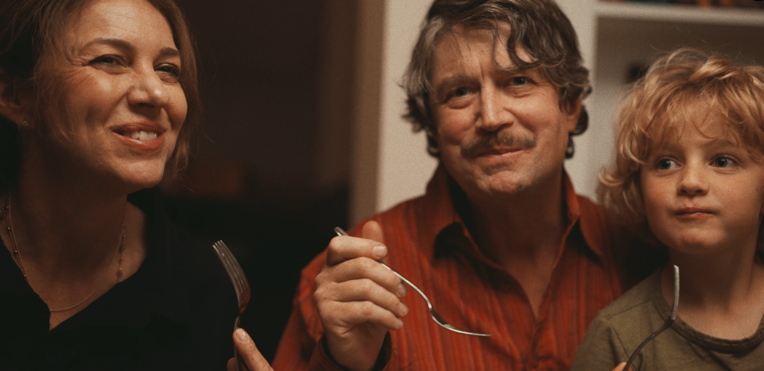 Family eating dinner.png